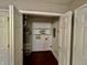 Well-organized utility room with water heater and functional shelving, conveniently located near other areas at 1820 N Dequincy St, Indianapolis, IN 46218