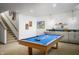 Finished basement featuring a billiards table and a cozy bar area perfect for entertaining at 19840 Chatham Shore Ln, Westfield, IN 46074