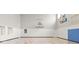 Indoor basketball court with hardwood floors, two hoops, and large viewing windows at 19840 Chatham Shore Ln, Westfield, IN 46074
