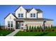 Charming two-story home featuring a welcoming front porch and a well-manicured lawn at 19840 Chatham Shore Ln, Westfield, IN 46074