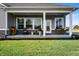 Inviting back porch with comfortable seating, perfect for enjoying the outdoors at 19868 Chatham Shore Ln, Westfield, IN 46074