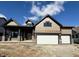 Charming single-Gathering home featuring a two-car garage, a cozy front porch, and stylish beige and brown siding at 19868 Chatham Shore Ln, Westfield, IN 46074