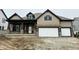 Charming two-story home featuring a brick-accented porch and a two-car garage at 19868 Chatham Shore Ln, Westfield, IN 46074
