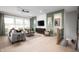 Bright living room with large windows, modern furnishings, and stylish decor accents at 19868 Chatham Shore Ln, Westfield, IN 46074