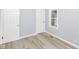 Bright bedroom with two closets, a window, and light gray walls at 3095 W 69Th St, Indianapolis, IN 46268