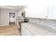 Kitchen featuring stainless appliances, white cabinets, and granite countertops at 3095 W 69Th St, Indianapolis, IN 46268