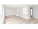 Spacious living room with fresh gray paint, new floors, ceiling fan and natural light at 3095 W 69Th St, Indianapolis, IN 46268