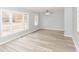 Bright living room featuring new floors, large windows, and a ceiling fan at 3095 W 69Th St, Indianapolis, IN 46268