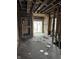 Open-concept living space with exposed framing and potential for renovation and design, awaiting your vision at 3178 Graceland Ave, Indianapolis, IN 46208