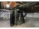 The basement features exposed ceiling and ductwork, a water heater, and modern utilities at 3636 Lasalle St, Indianapolis, IN 46218