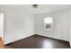 Bedroom featuring hardwood floors, white walls, a window, and overhead lighting at 3636 Lasalle St, Indianapolis, IN 46218