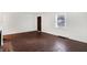 Light and airy living room featuring refinished hardwood floors and a traditional fireplace at 3636 Lasalle St, Indianapolis, IN 46218