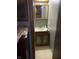 A half bathroom with a wooden vanity and sink at 3728 Orchard Ave, Indianapolis, IN 46218
