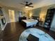 Spacious bedroom features hardwood floors, ceiling fan and ensuite bathroom at 3965 N Meridian St # 7D, Indianapolis, IN 46208