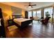 Cozy bedroom featuring a king-size bed, large windows, and an inviting chaise lounge at 3965 N Meridian St # 7D, Indianapolis, IN 46208