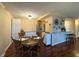 Eat-in dining area connected to a modern kitchen and living area featuring stylish décor and light at 3965 N Meridian St # 7D, Indianapolis, IN 46208
