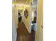 Inviting hallway leads to various rooms of the home, showcasing the flooring and natural light at 3965 N Meridian St # 7D, Indianapolis, IN 46208
