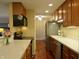 Updated kitchen with stainless steel appliances, ample counter space, and warm-toned cabinets at 3965 N Meridian St # 7D, Indianapolis, IN 46208