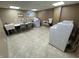 Clean community laundry room offering residents a convenient place to wash and dry clothes with multiple machines and seating at 3965 N Meridian St # 7D, Indianapolis, IN 46208