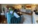 Open-concept living room with hardwood floors, stylish furniture, modern décor and a view into the kitchen at 3965 N Meridian St # 7D, Indianapolis, IN 46208