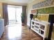 Cozy living room with hardwood floors, white shelving, stylish décor and bright, sliding-glass door at 3965 N Meridian St # 7D, Indianapolis, IN 46208