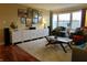Inviting living room with modern decor, hardwood floors, a large window, and comfortable seating at 3965 N Meridian St # 7D, Indianapolis, IN 46208