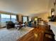 Spacious living room featuring hardwood floors, a large window, stylish furniture and modern décor at 3965 N Meridian St # 7D, Indianapolis, IN 46208
