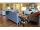 Open-concept living space and kitchen with hardwood floors, stylish décor and plenty of light at 3965 N Meridian St # 7D, Indianapolis, IN 46208