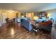 Open-concept living space with dining area and kitchen featuring hardwood floors and comfortable seating at 3965 N Meridian St # 7D, Indianapolis, IN 46208