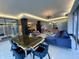 This elegant lobby features modern lighting, large windows, comfortable seating, and a stylish table set for gatherings at 3965 N Meridian St # 7D, Indianapolis, IN 46208
