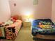Bright bedroom featuring twin beds and a whimsical cartoon theme with fun decor elements at 5021 Greenside Dr, Indianapolis, IN 46235