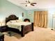 Serene main bedroom features a luxurious bed, elegant curtains, and soft, neutral tones at 5021 Greenside Dr, Indianapolis, IN 46235