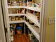 Organized walk-in pantry with ample shelving and storage space for food, kitchen supplies, and other household items at 5021 Greenside Dr, Indianapolis, IN 46235