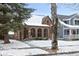 Charming brick home featuring arched windows and mature tree, inviting curb appeal at 5444 Carrollton Ave, Indianapolis, IN 46220