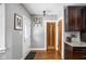 Inviting hallway with hardwood floors and access to multiple rooms at 5444 Carrollton Ave, Indianapolis, IN 46220