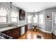 Charming kitchen with stainless steel appliances, granite countertops, and a breakfast nook with bay windows at 5444 Carrollton Ave, Indianapolis, IN 46220