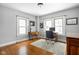 Bright office space with hardwood floors, natural light, and ample desk space at 5444 Carrollton Ave, Indianapolis, IN 46220