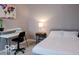 Simple bedroom design with desk, soft carpet, and a comfortable bed at 621 W 10Th St, Indianapolis, IN 46202