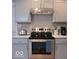 Well-equipped kitchen with stainless steel appliances and ample cabinet space at 621 W 10Th St, Indianapolis, IN 46202