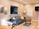 Cozy living room with modern furniture, connecting seamlessly to the kitchen at 621 W 10Th St, Indianapolis, IN 46202