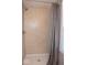 Shower stall with neutral tile surround, modern fixtures, and glass door at 621 W 10Th St, Indianapolis, IN 46202
