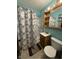 Small bathroom featuring a shower, toilet, and sink with cabinet at 637 N Oakland Ave, Indianapolis, IN 46201