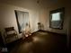 Bare bedroom with two windows, carpet, and two chairs at 637 N Oakland Ave, Indianapolis, IN 46201