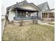 View of charming single-Gathering home with covered porch and well-maintained front yard at 637 N Oakland Ave, Indianapolis, IN 46201