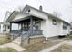 Side view of home featuring a welcoming front porch and traditional architecture at 637 N Oakland Ave, Indianapolis, IN 46201