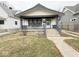Charming single-Gathering home features a covered front porch and inviting curb appeal at 637 N Oakland Ave, Indianapolis, IN 46201