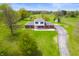 Aerial view of the home, showcasing the expansive lawn and the surrounding landscape at 6629 N 600 W, Fairland, IN 46126