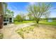 Wide shot of a large backyard and patio area with green space and mature trees at 6629 N 600 W, Fairland, IN 46126