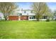 Spacious backyard of home featuring lush green grass and mature trees at 6629 N 600 W, Fairland, IN 46126