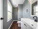 Renovated bathroom with modern vanity, white accents and fixtures, and vinyl flooring at 6629 N 600 W, Fairland, IN 46126